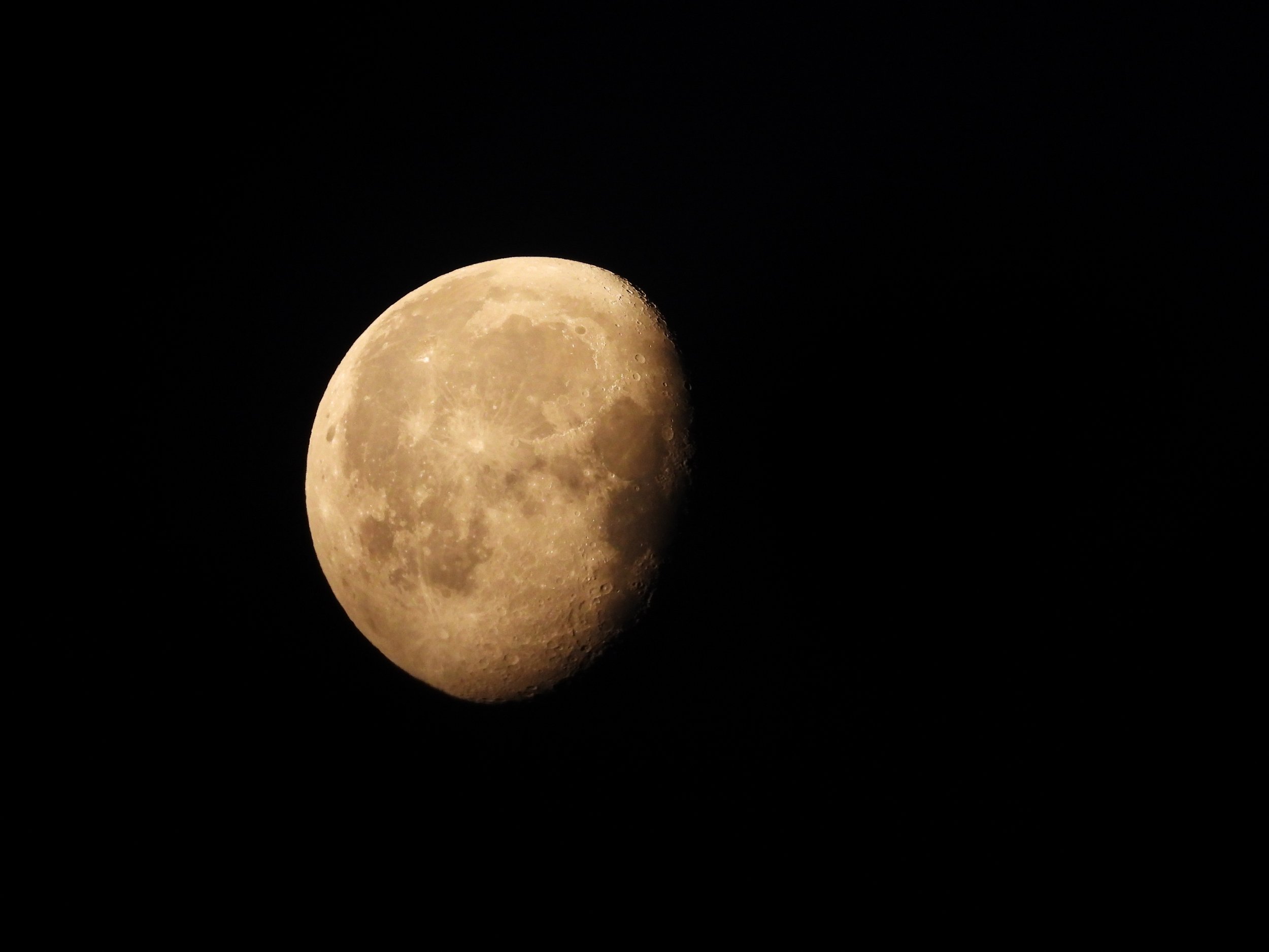 A waning gibbous Moon on a black background