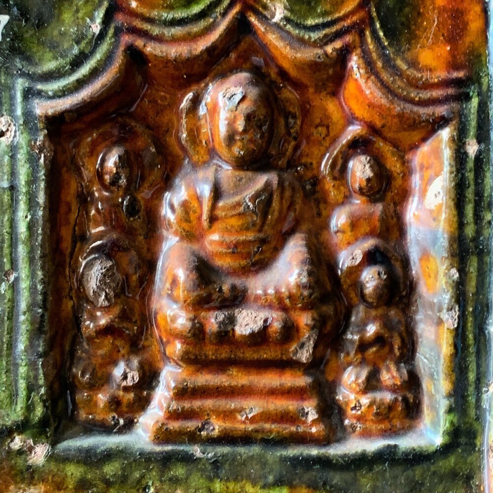 Tile depicting the seated Buddha surrounded by attendants from Fonthill Castle in Doylestown, PA