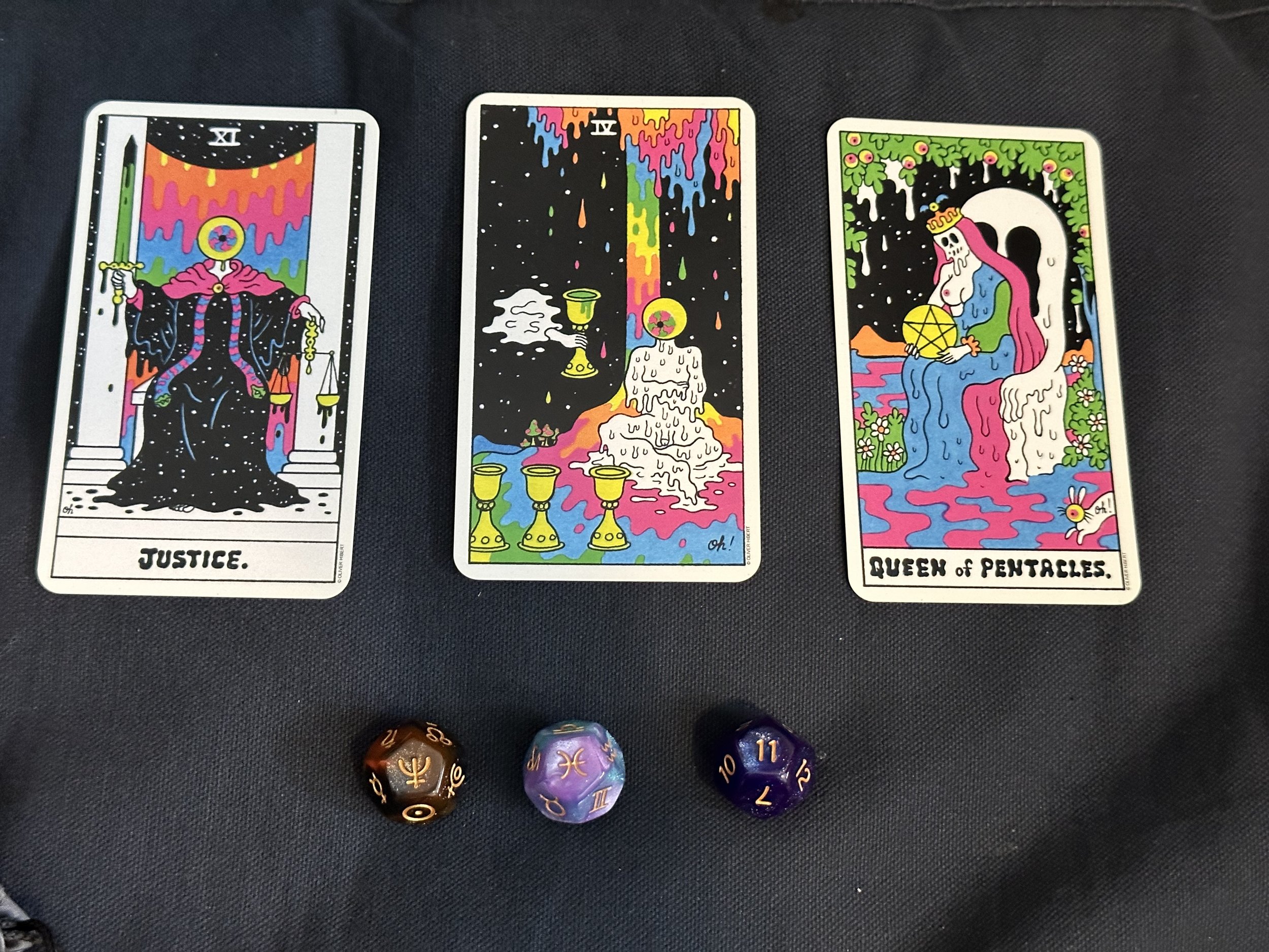 Three tarot cards (Justice, 4 of Cups, and Queen of Pentacles) and astrodice showing Neptune in Pisces in the 11th house.