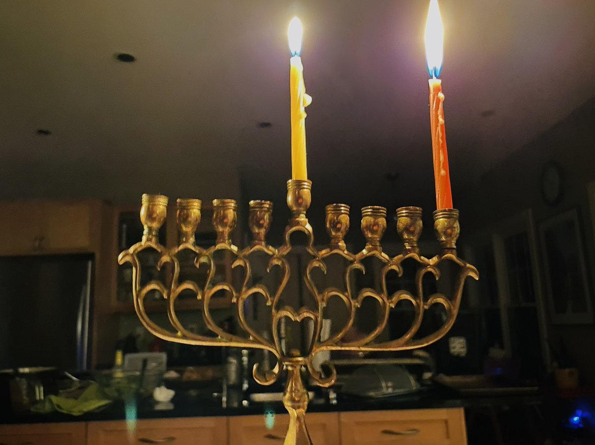 A chanukiah with the shamash and first candle lit